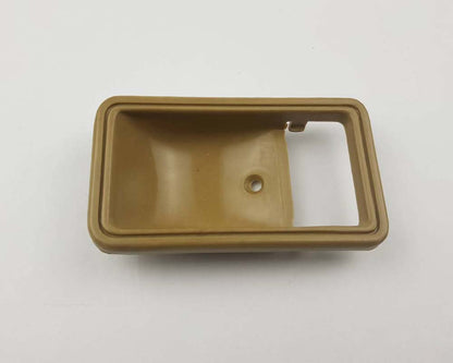Beige inner door handle bezel detail 2 for Toyota Hilux Pickup / RN30 / RN42 / LN30 / LN40 / Stout RK110