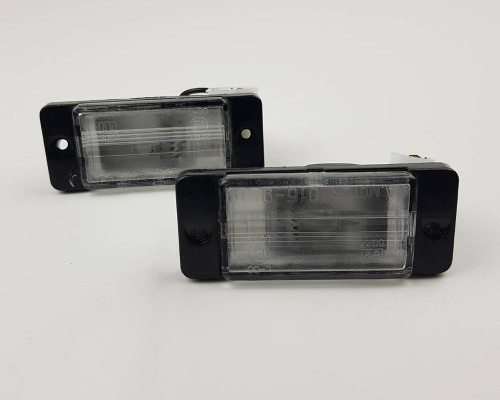 Mitsubishi L200 Strada license plate light pair