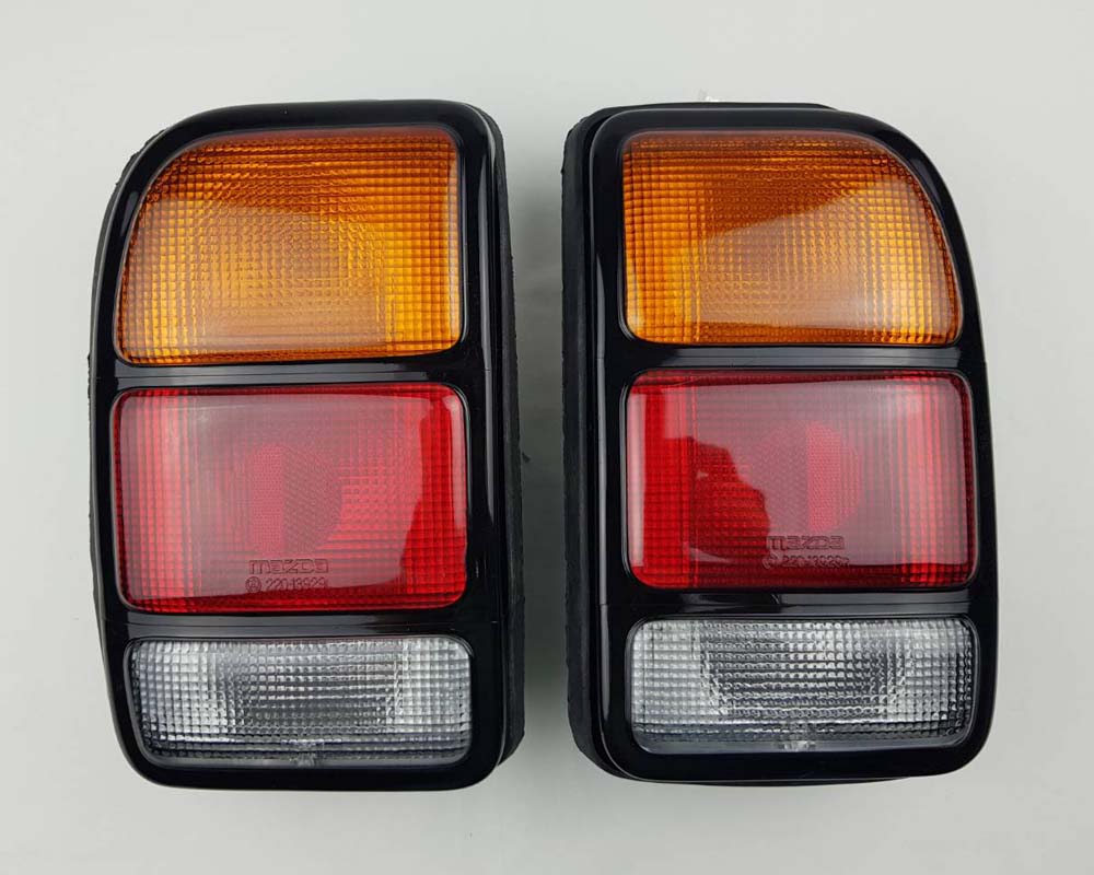 Rear Combination Tail Light for Mazda B1400 Pickup - CAB - Black - Amber / Red / Clear - LH + RH Pair