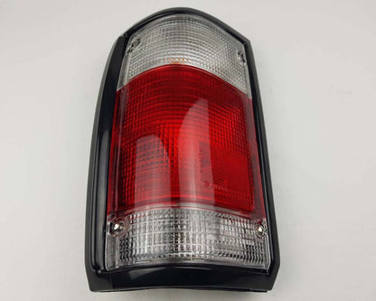 Mazda Magnum Rear Combination Tail Light – Red / Clear – Black Frame – LH / Left – view 3