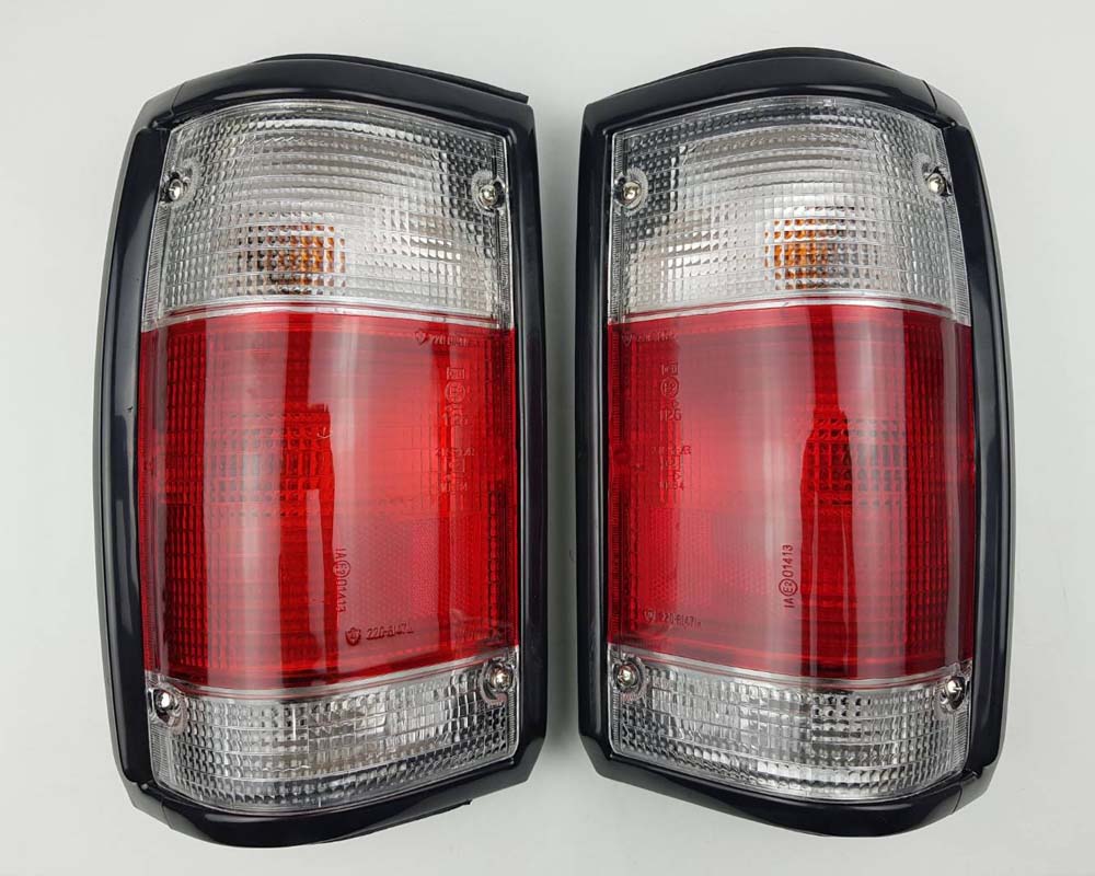 Mazda Magnum Rear Combination Tail Light – Red / Clear – Black Frame – LH + RH Pair