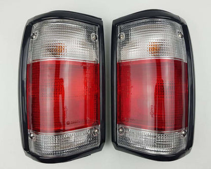 Mazda Magnum Rear Combination Tail Light – Red / Clear – Black Frame – LH + RH Pair
