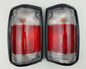 Mazda Magnum Rear Combination Tail Light – Red / Clear – Black Frame – LH + RH Pair