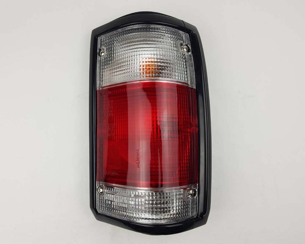 Mazda Magnum Rear Combination Tail Light – Red / Clear – Black Frame – RH / Right