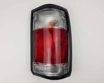 Mazda Magnum Rear Combination Tail Light – Red / Clear – Black Frame – RH / Right