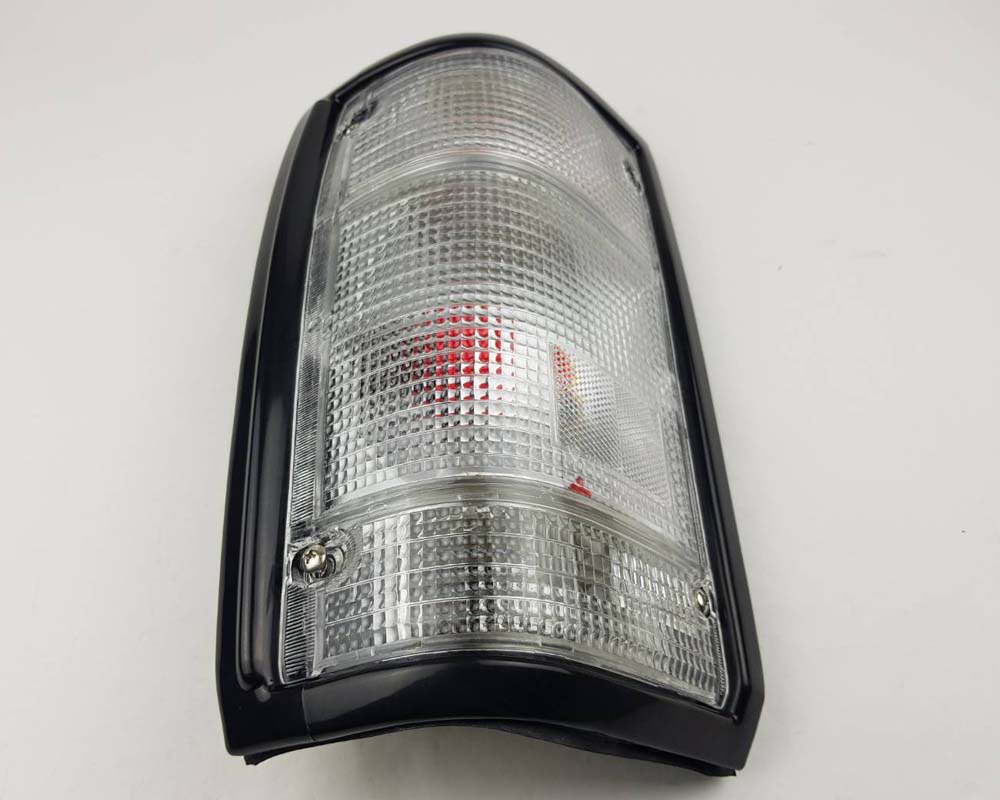 Mazda Magnum Rear Combination Tail Light – Full Clear – Black Frame – LH / Left – view 3
