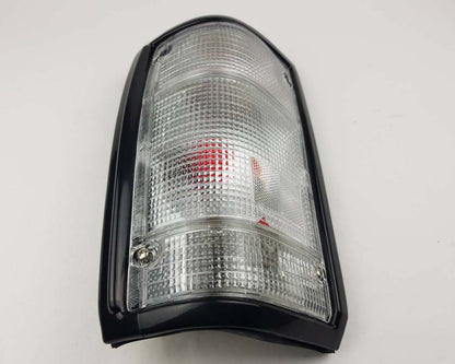Mazda Magnum Rear Combination Tail Light – Full Clear – Black Frame – LH / Left – view 3