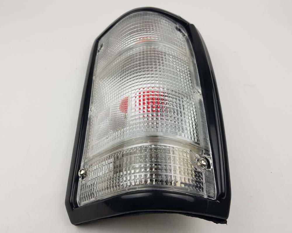 Mazda Magnum Rear Combination Tail Light – Full Clear – Black Frame – RH / Right – view 3