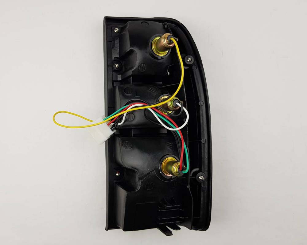 Mazda B2500 Fighter Rear Combination Tail Light – Red / Clear – Black Frame – LH / Left – view 2