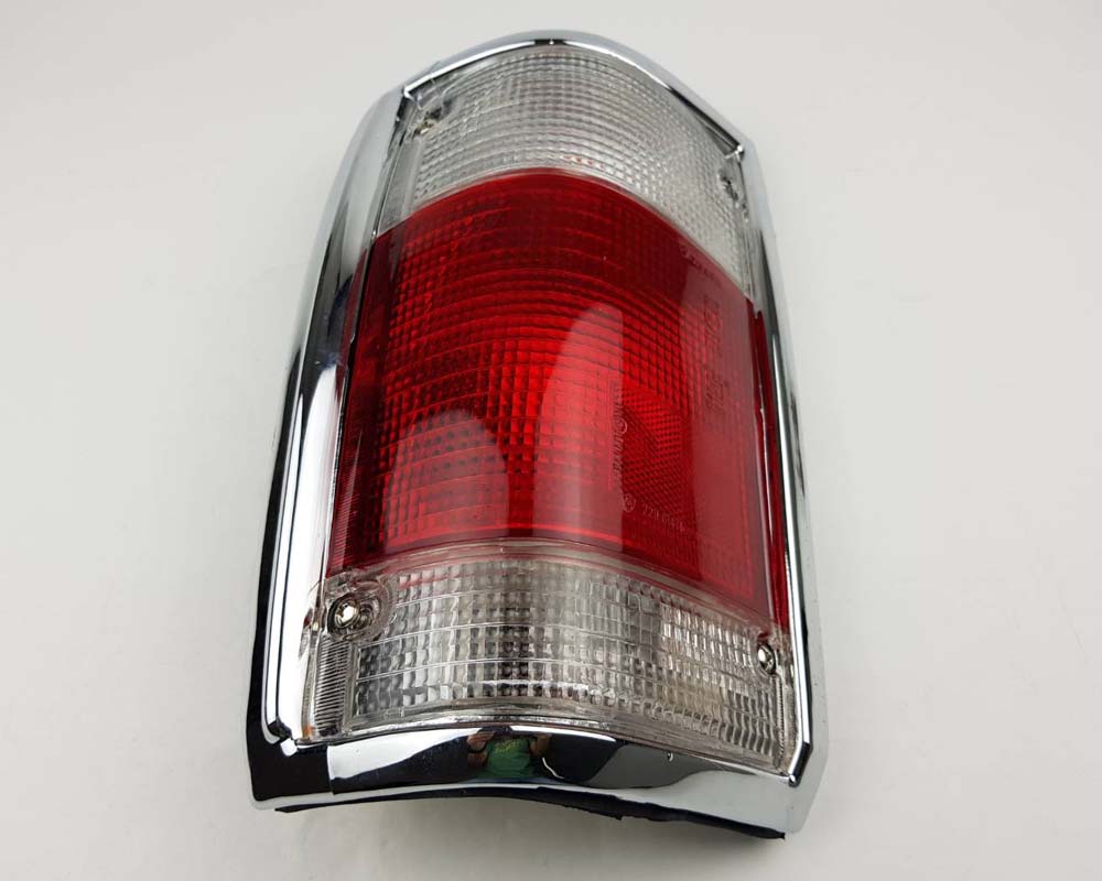 Mazda Magnum Rear Combination Tail Light – Red / Clear – Chrome Frame – LH / Left – view 3