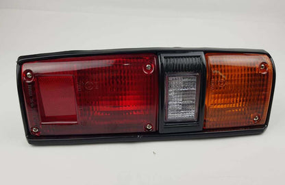 Left Hand (LH) rear combination tail light for 1979–1984 Toyota Hilux RN30 / RN40 Pickup OEM 81560-39475