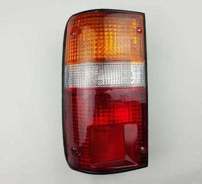 Left Hand (LH) rear combination tail light for 1987–1999 Toyota Hilux / Mighty-X LN85 Pickup OEM 81560-89163